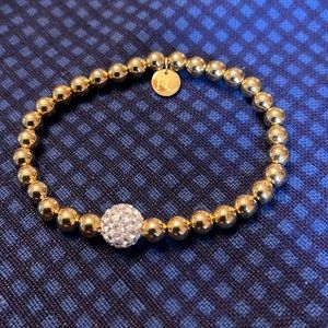 Gold and Crystal stretch bracelet by rustic cuff.